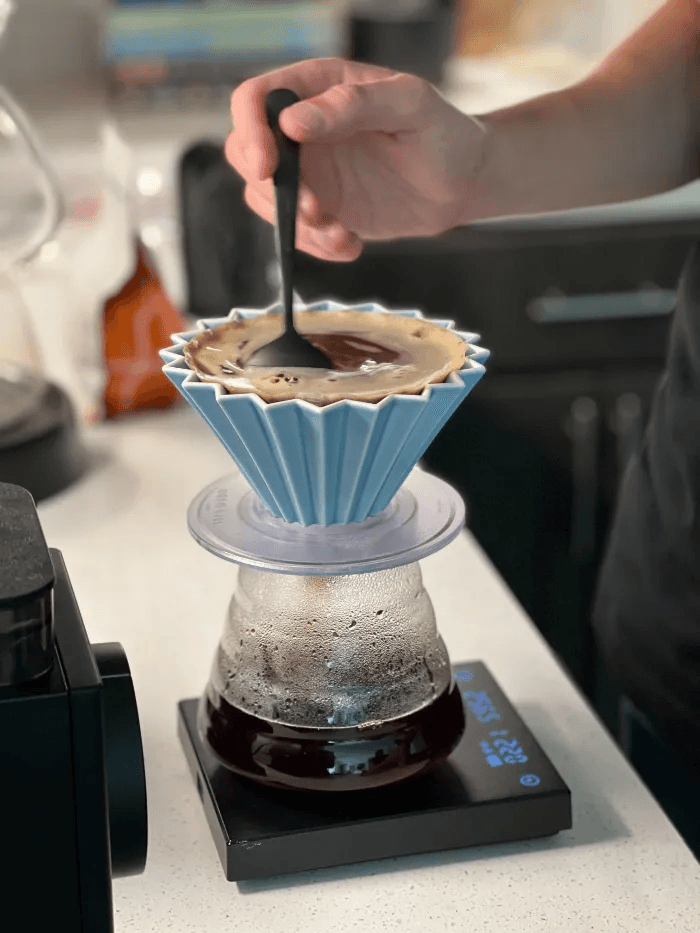 Stirring coffee during pour-over brew.